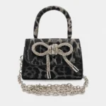 Cartera Animal Print con Moño de Strass