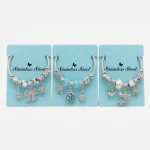 Pulsera de Acero Plateada con Charms Variados
