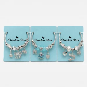 Pulsera de Acero Plateada con Charms Variados