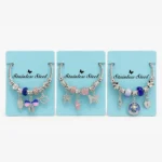 Pulsera de Acero Plateada con Charms Variados
