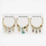 Pulsera Dorada Elastizada con Dijes Colgantes