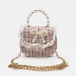 Cartera Tejida con Moño de Perlas